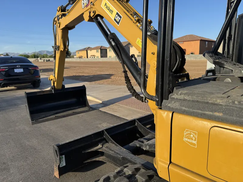 Desert Valley Grading CAT 303 mini excavator on site in Arizona