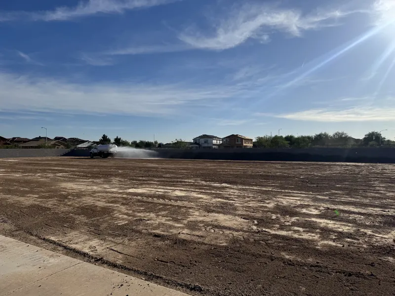 Water truck soil conditioning and moisture control on a Desert Valley Grading project
